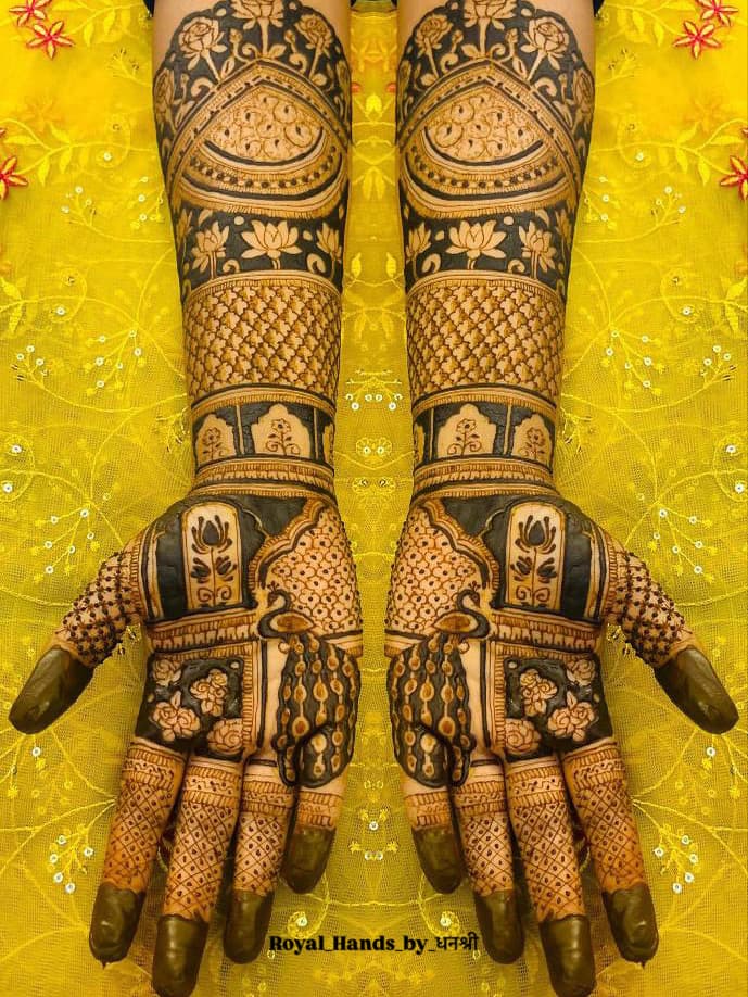 Symmetrical royal bridal peacock mehendi design by Royal Hands By Dhanashree