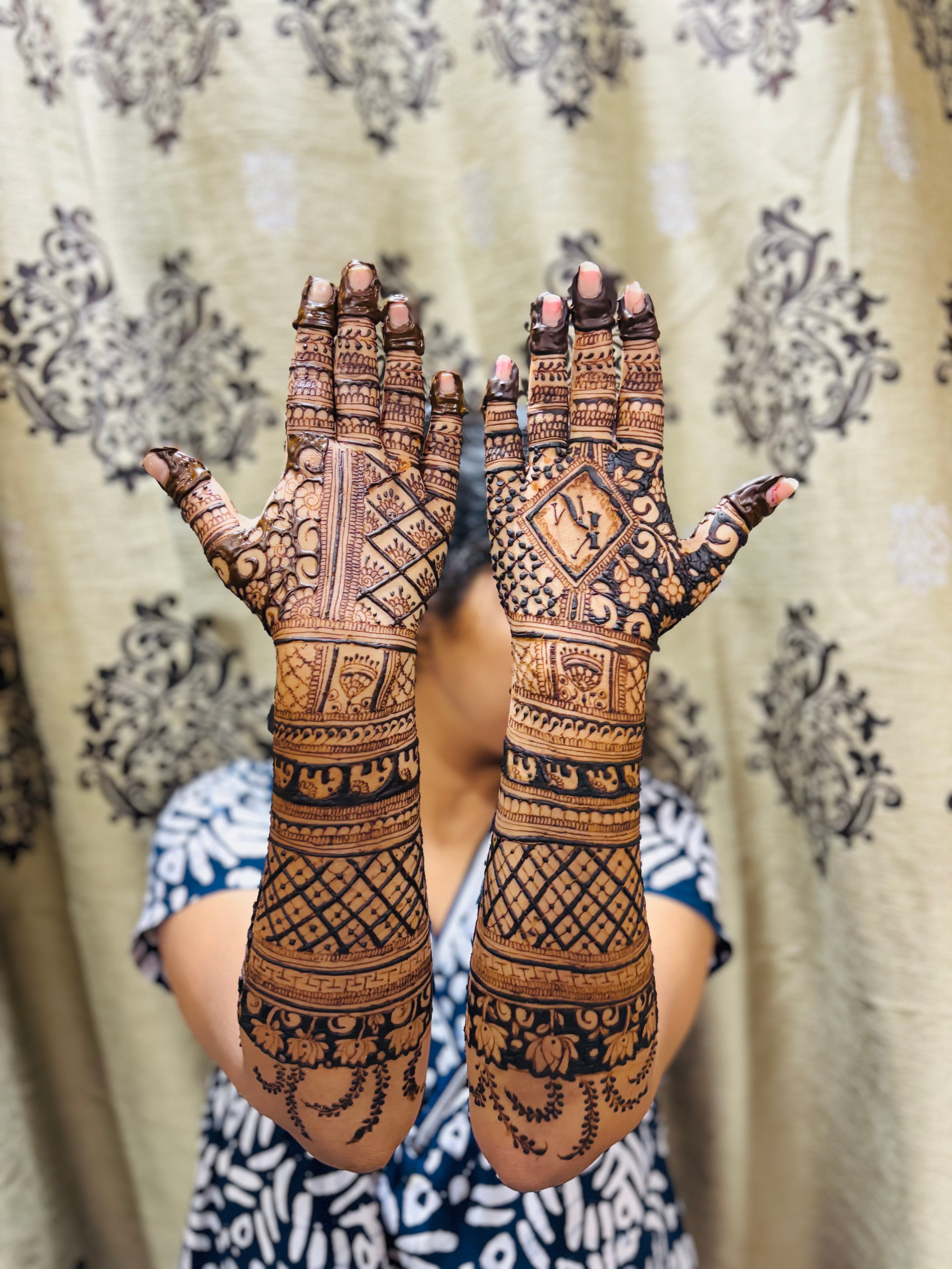 Personalized initials and elephant wedding mehendi design by Royal Hands By Dhanashree